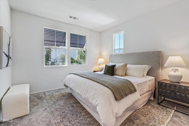 bedroom featuring light carpet