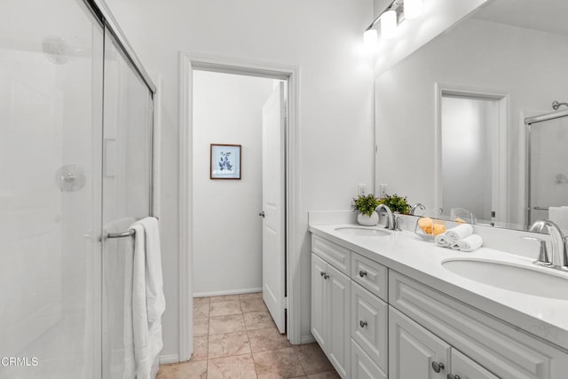 bathroom with vanity, tile patterned flooring, and a shower with door