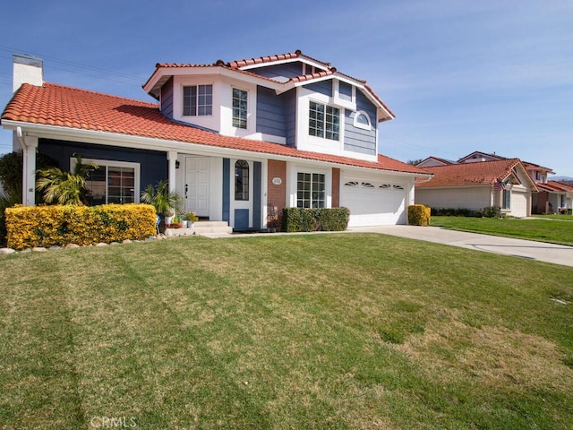 view of front facade with a front lawn and a garage