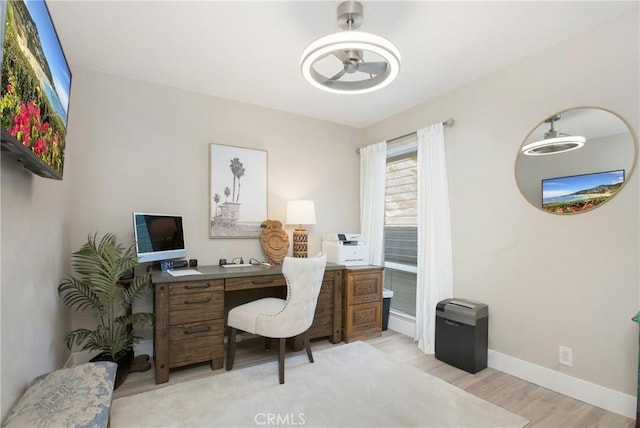 office area with light hardwood / wood-style floors