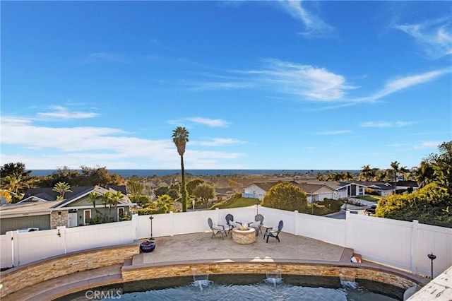 view of swimming pool featuring an outdoor fire pit and a patio area