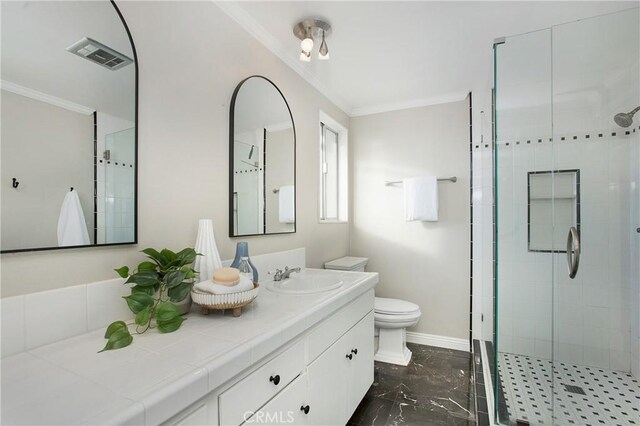 bathroom featuring vanity, a shower with door, ornamental molding, and toilet