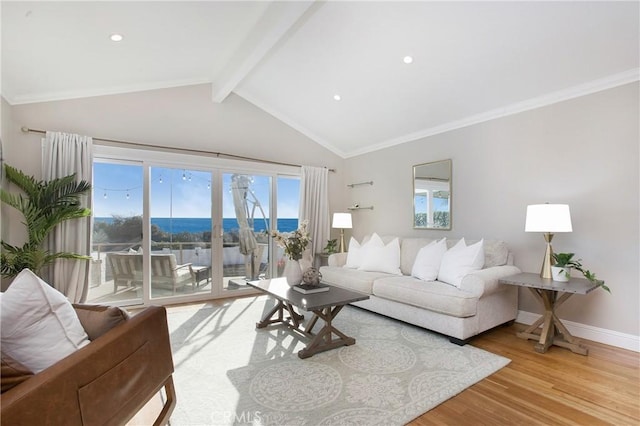 living room with lofted ceiling with beams, crown molding, and hardwood / wood-style floors