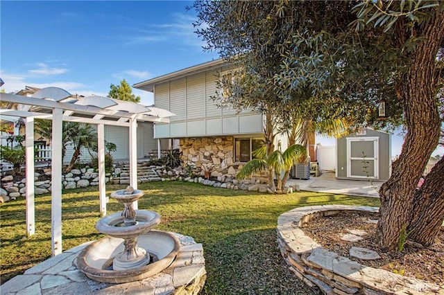 view of yard featuring a pergola and a storage shed