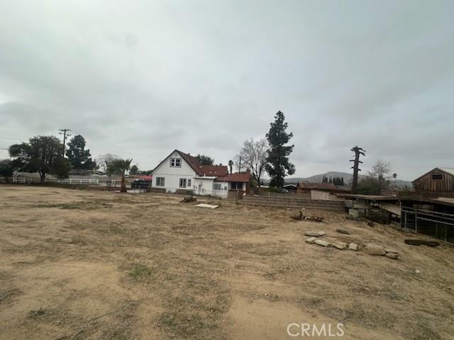 view of yard with a rural view