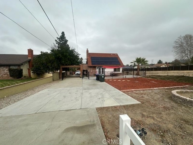 view of front of property with solar panels