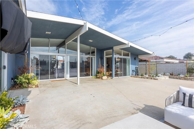 rear view of property with a patio area