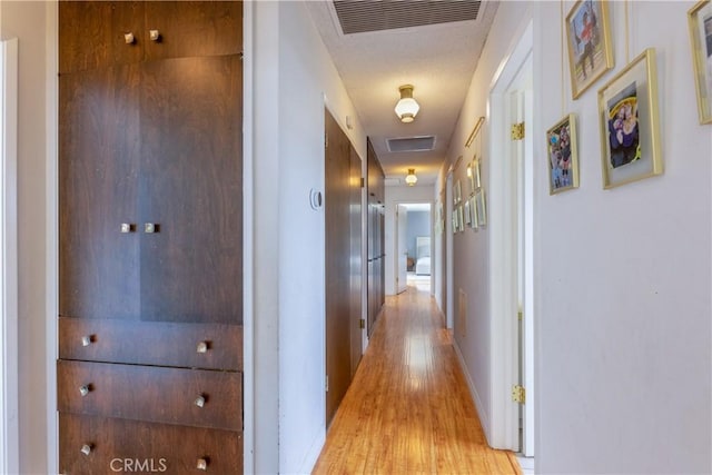 hallway featuring light hardwood / wood-style floors