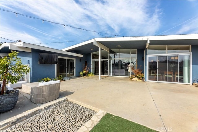 rear view of property with a patio