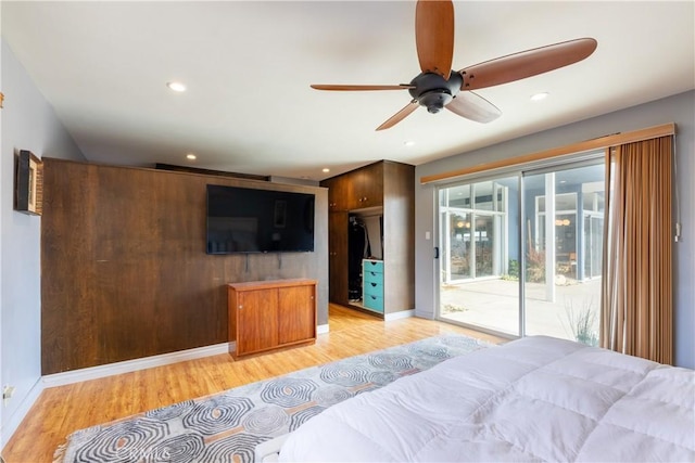 bedroom with access to exterior, ceiling fan, and light hardwood / wood-style flooring