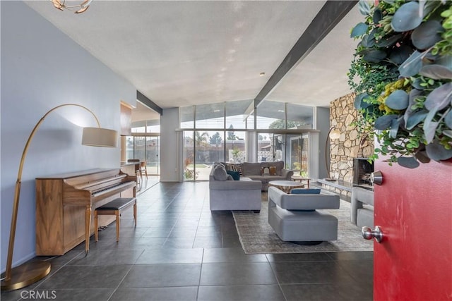 tiled living room featuring expansive windows