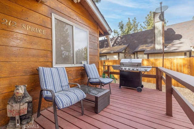 wooden terrace with grilling area