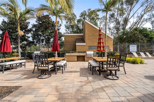 view of patio / terrace with area for grilling and a grill