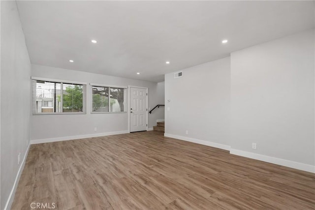 unfurnished room with light hardwood / wood-style floors