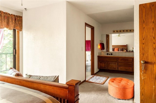 bedroom featuring light colored carpet