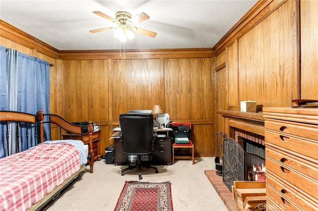 bedroom with light carpet, a fireplace, and wooden walls