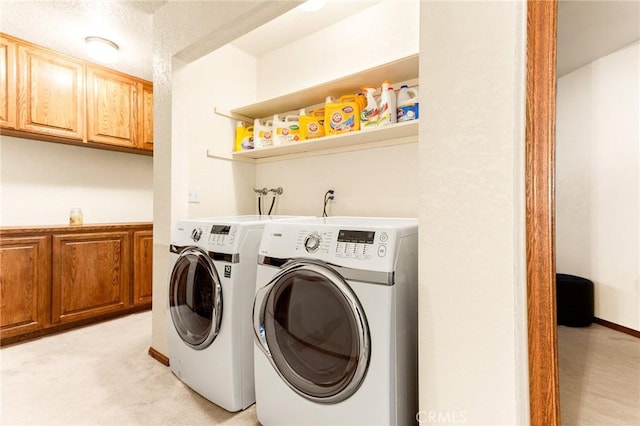 laundry area featuring cabinets and washer and dryer