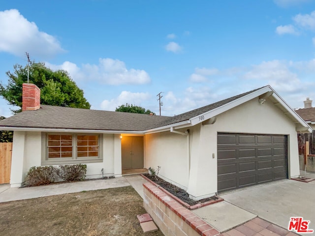 ranch-style home featuring a garage