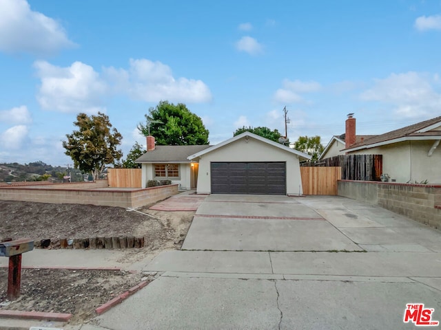 single story home with a garage