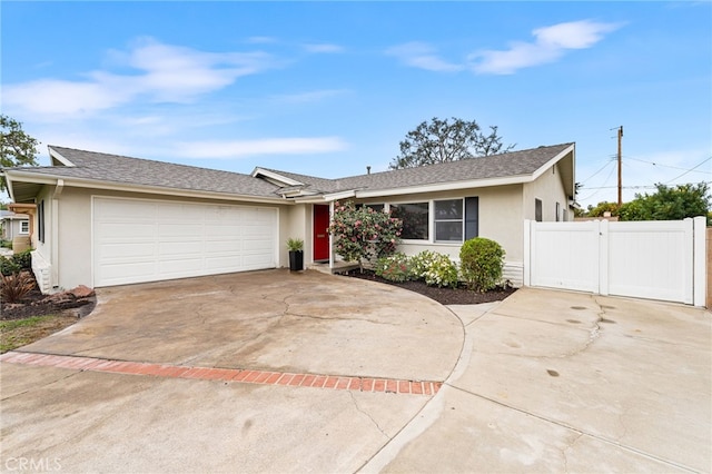 ranch-style house featuring a garage