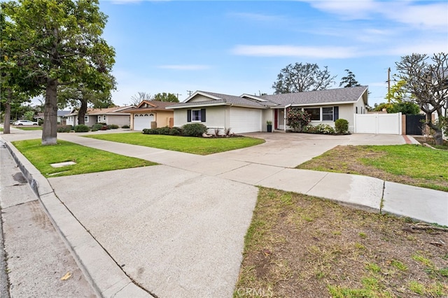 single story home featuring a garage and a front yard