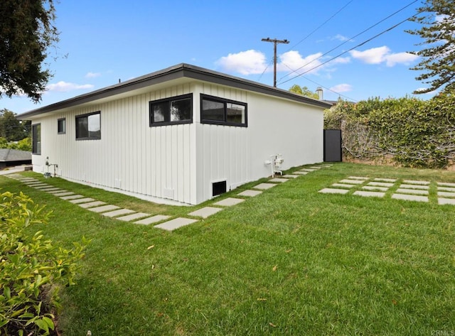 view of home's exterior with a yard