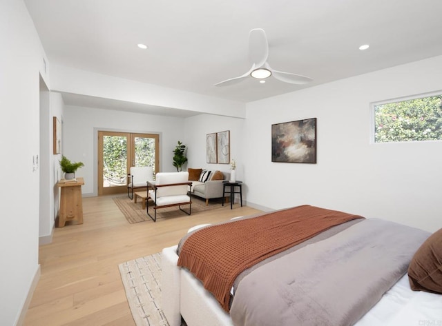 bedroom featuring light hardwood / wood-style floors, french doors, and ceiling fan