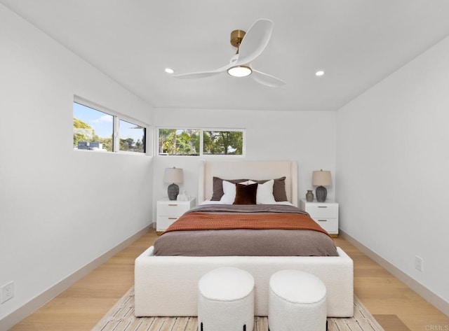 bedroom featuring ceiling fan and light hardwood / wood-style floors