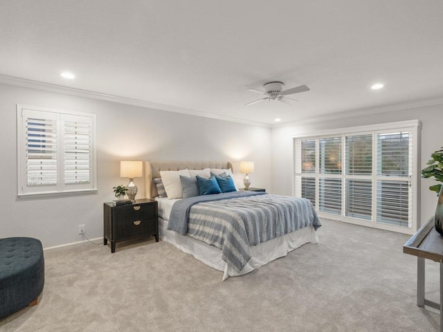 carpeted bedroom with crown molding and ceiling fan