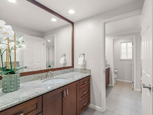 bathroom with vanity and toilet