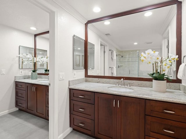 bathroom featuring vanity and a shower with shower door