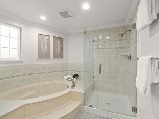 bathroom with crown molding and independent shower and bath