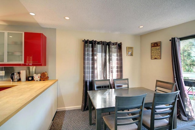 dining area with a textured ceiling