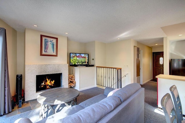 living room featuring light carpet and a textured ceiling