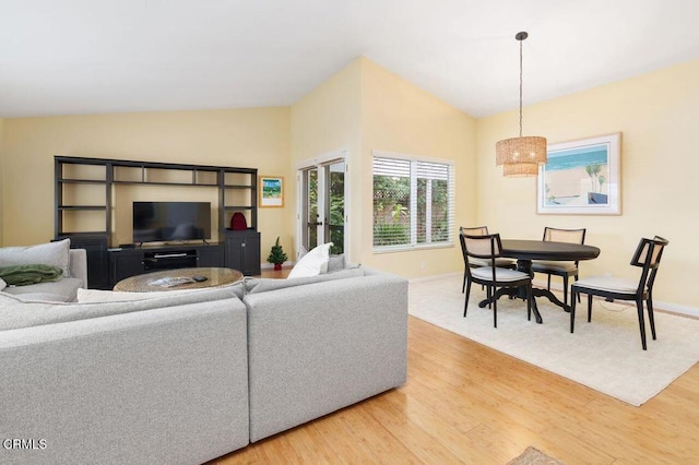 living room with lofted ceiling and hardwood / wood-style floors