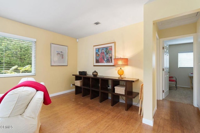 office with light hardwood / wood-style flooring