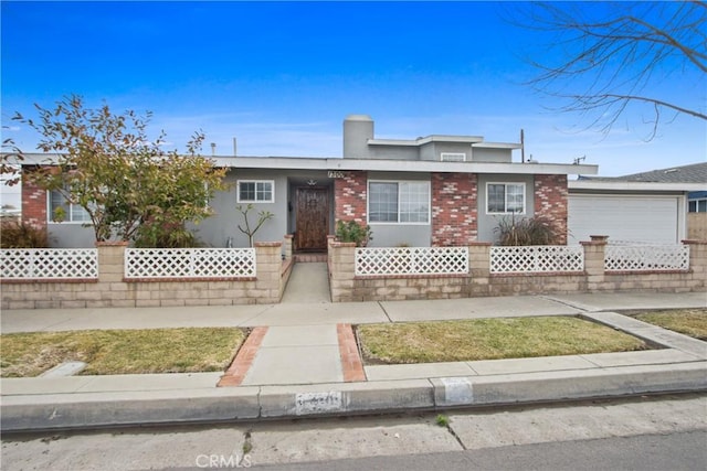 single story home featuring a garage