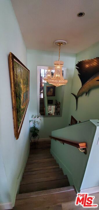 staircase featuring hardwood / wood-style floors