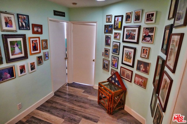 hall with dark hardwood / wood-style floors