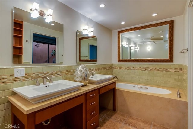 bathroom with a relaxing tiled tub and vanity