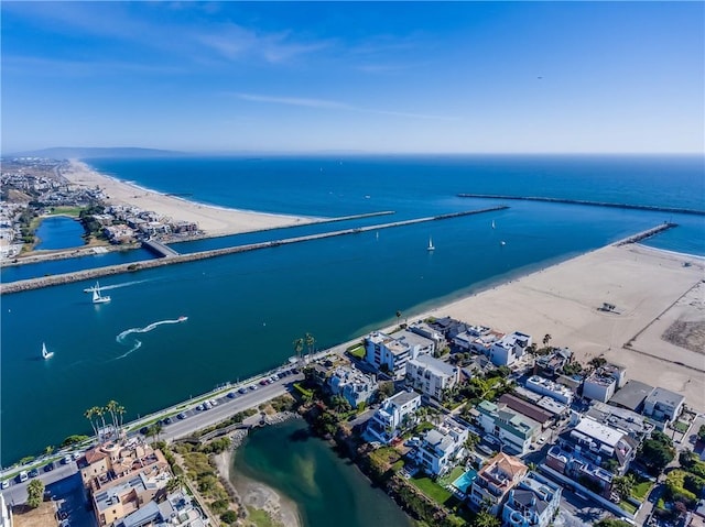 birds eye view of property featuring a water view and a view of the beach