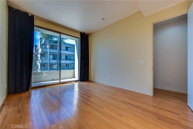 spare room featuring light wood-type flooring