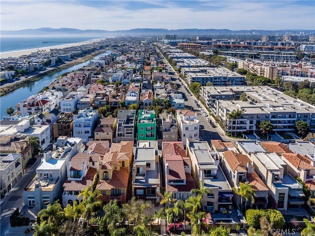 birds eye view of property featuring a water and mountain view