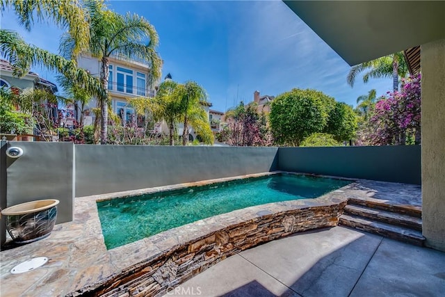 view of pool with a patio area