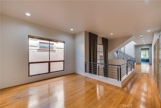 unfurnished room featuring light hardwood / wood-style floors