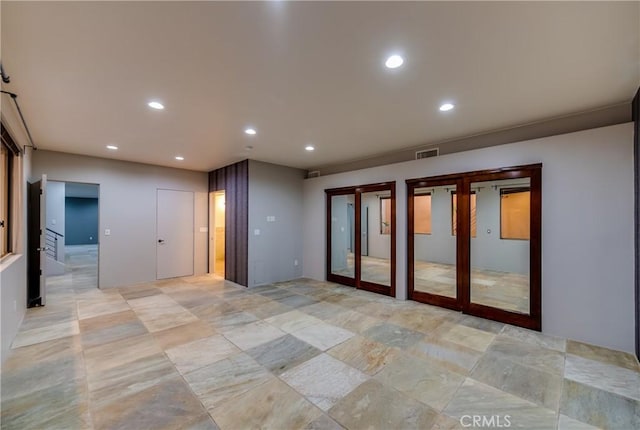 empty room featuring french doors