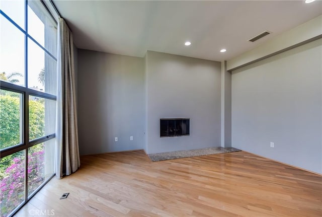 unfurnished living room featuring light hardwood / wood-style flooring