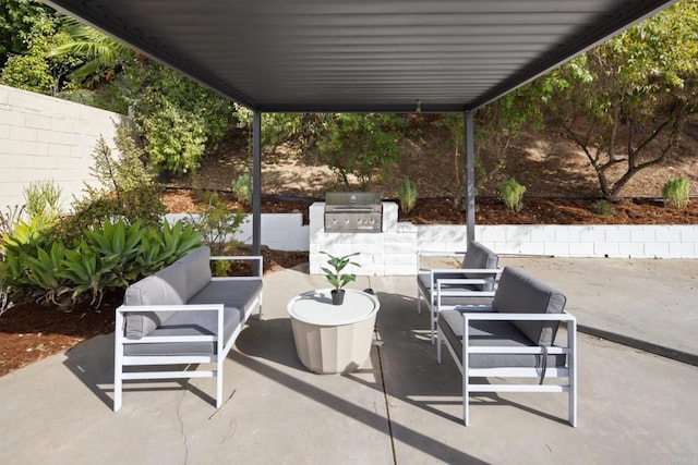 view of patio / terrace featuring an outdoor kitchen, an outdoor living space, and area for grilling