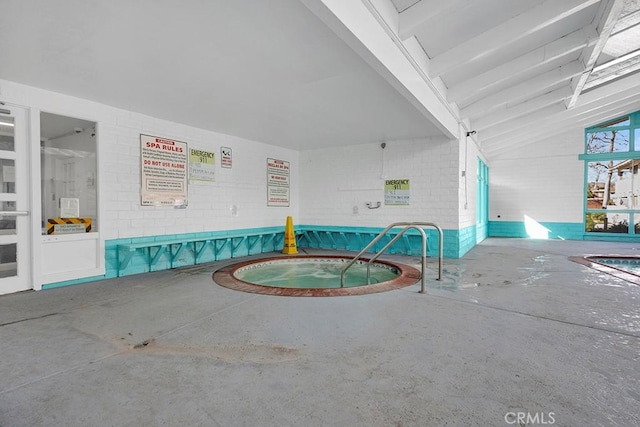 view of pool featuring an indoor hot tub