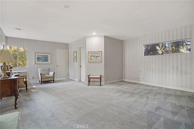 living area with light colored carpet